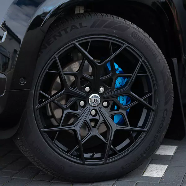 urban automotive wheel with contrasting blue calliper