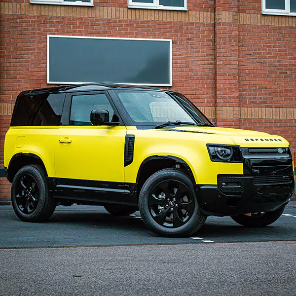 yellow wrap on land rover defender 90