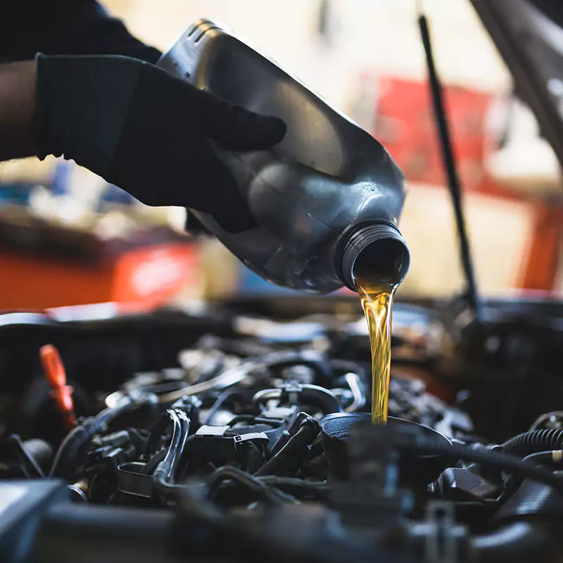 New oil being poured into land rover engine