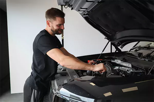 workshop technician carrying our a land rover service